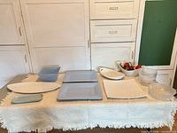 All ten serveware pieces laid out on table