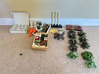 All items laid out showing candles, holders, elephant, greenery