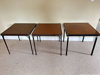 Three folding card tables top view