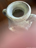 Top angled view showing wide mouth and double handles of the terracotta vase