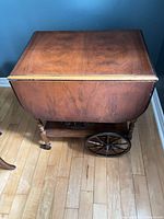 Cart with leaves down, showing wheels and shelves