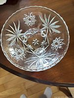 Top view of clear pressed glass serving bowl showing starburst pattern