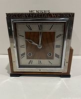 Front view showing dial, chrome bezel, and McNish's topper