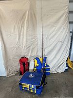 Full lot showing fishing rod, life jackets, bag, fender