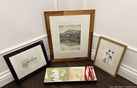 Group shot showing all four framed artworks: etching, two drawings, acrylic canvas