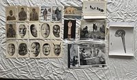 Front view showing array of postcards and prints laid out on fabric