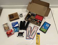 overview of all office supplies laid out on white surface