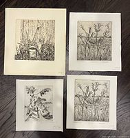 Group shot of all four etching prints laid out