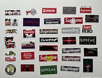 All 30 assorted Supreme stickers laid out on white background