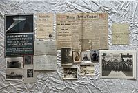 Full layout of posters, newspaper, letters and photographs