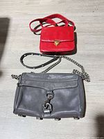 Front view of both bags showing sizes, straps, and hardware