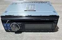 Front angled view of Alpine CDE-121 car stereo showing buttons, knob and display