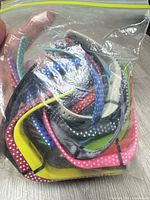 Bag of mixed Fitbit bands, overhead view
