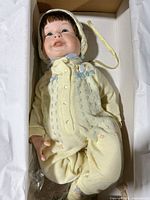 Doll in box showing full body and outfit