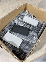 Full box showing quantity of individually bagged Talon phone cases