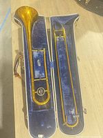 Open case with trombone bell and slide