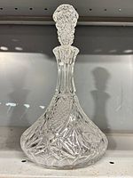 Full view of cut crystal decanter with stopper inserted