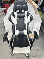 Front view of S-Racer gaming chair showing full structure and base