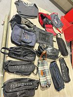 All eleven bags spread on table for overview