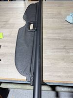 Full length view of cargo cover showing housing and extended shade