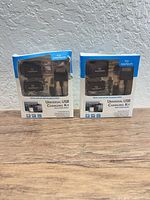 Front view of two sealed Naztech USB charging kits