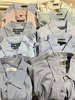 Group shot of all 11 men’s dress shirts laid out