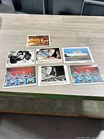 Overview of all seven NASA 8x10 photos on table