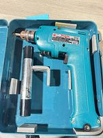 Makita cordless drill in case with battery visible