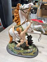 Front left view of full statue on base