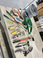 Overall view of bucket and all hand tools laid out