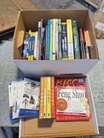 Open bankers box showing full assortment of books