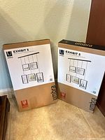 Two boxed Umbra Exhibit 5 frame sets