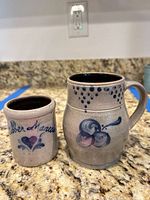 Pitcher and cup side by side showing size and decoration