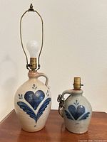 Both Rowe Pottery jug lamps side by side showing relative sizes and full hardware