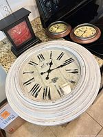 All four clocks grouped on countertop
