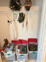 Closet view with totes, tree, topiary, wreath, ghost decor and gingerbread figure