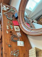Overview of all jewelry pieces arranged on dresser