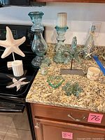 Group shot showing all aqua glass decor on countertop