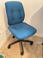 Front angled view of aqua blue swivel chair showing seat, backrest, and five-star base