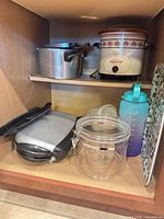 All items arranged in cabinet