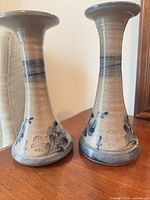 Full view of both salt-glazed candlesticks front