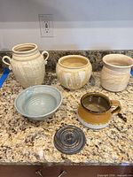 Group shot of all six stoneware pieces on countertop