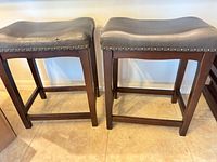 Front view of both barstools showing overall design and condition