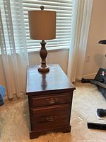 File cabinet with lamp placed on top, full view