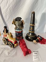 Group shot of all four decanters with stoppers visible