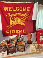 Overall lot showing banner, lamp, telephone, figurine, and four boxed trucks