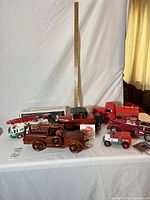 Group shot of all fire trucks, wooden model, Hess box, Beam’s card