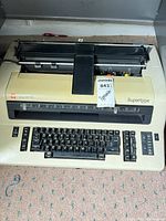 Top view of Olympia Supertype beige electric typewriter showing keyboard and carriage