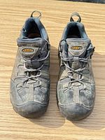 Top view of both shoes showing laces, uppers, and brand logo