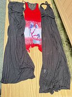 Full view of three dresses laid flat showing colors, lengths and overall style